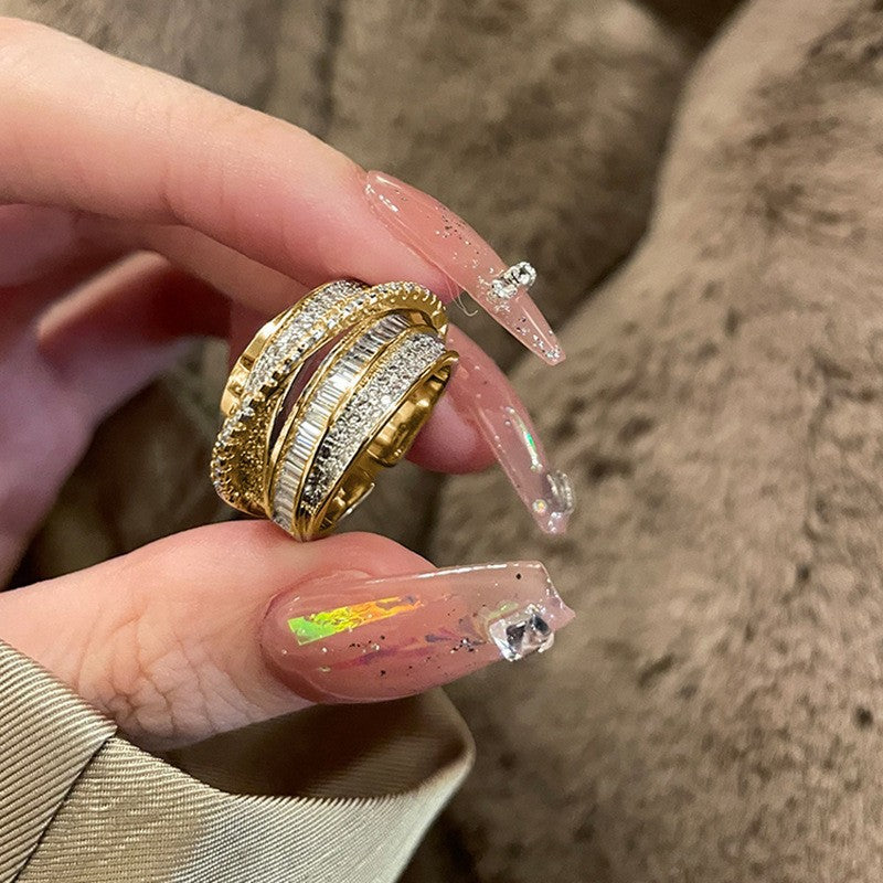 Retro cross-shaped hollowed-out ring with adjustable size adjustment function